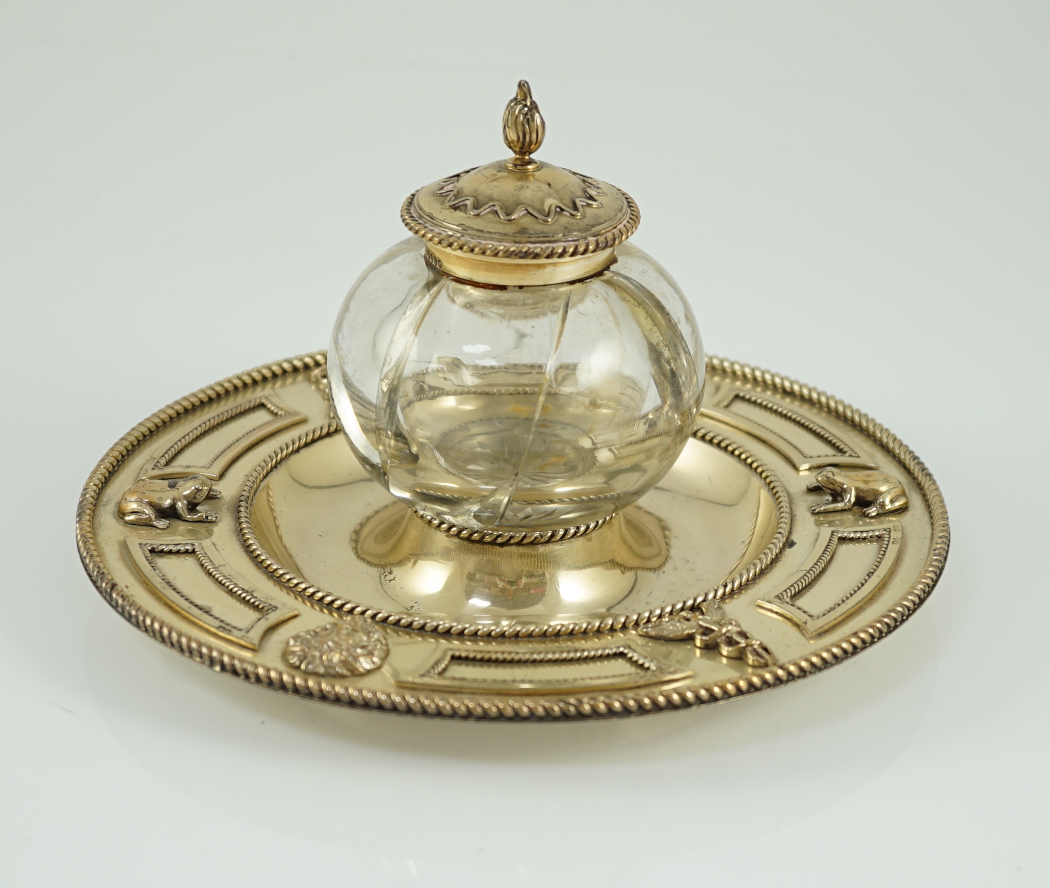 A Victorian silver gilt circular inkstand, by Robert Hennell III